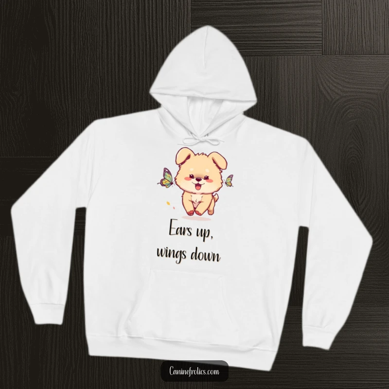 Funny Dog Hoodie: A fluffy dog with ears flopping energetically chases a butterfly, expressing pure joy and a whimsical sense of adventure.