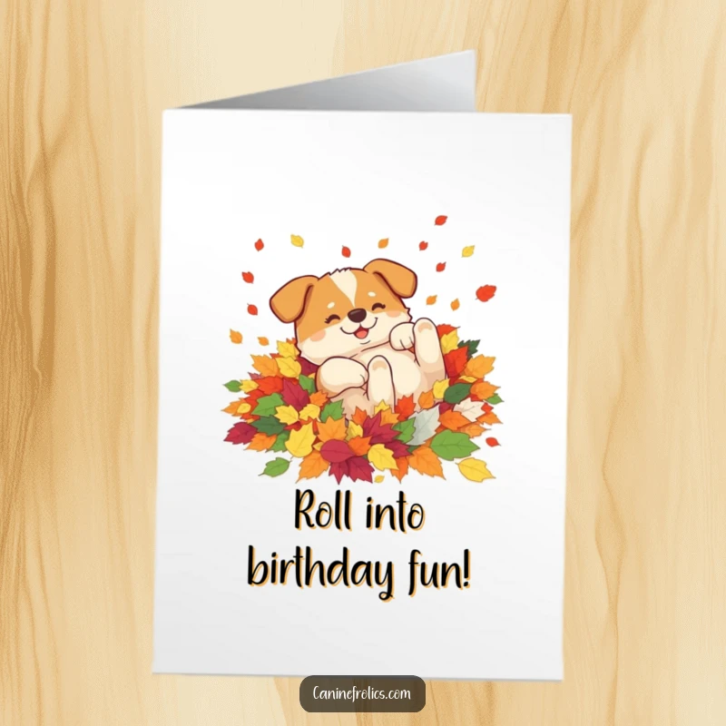 Funny free printable birthday card: A joyful dog ecstatically rolling around in a large, vibrant pile of fallen autumn leaves.